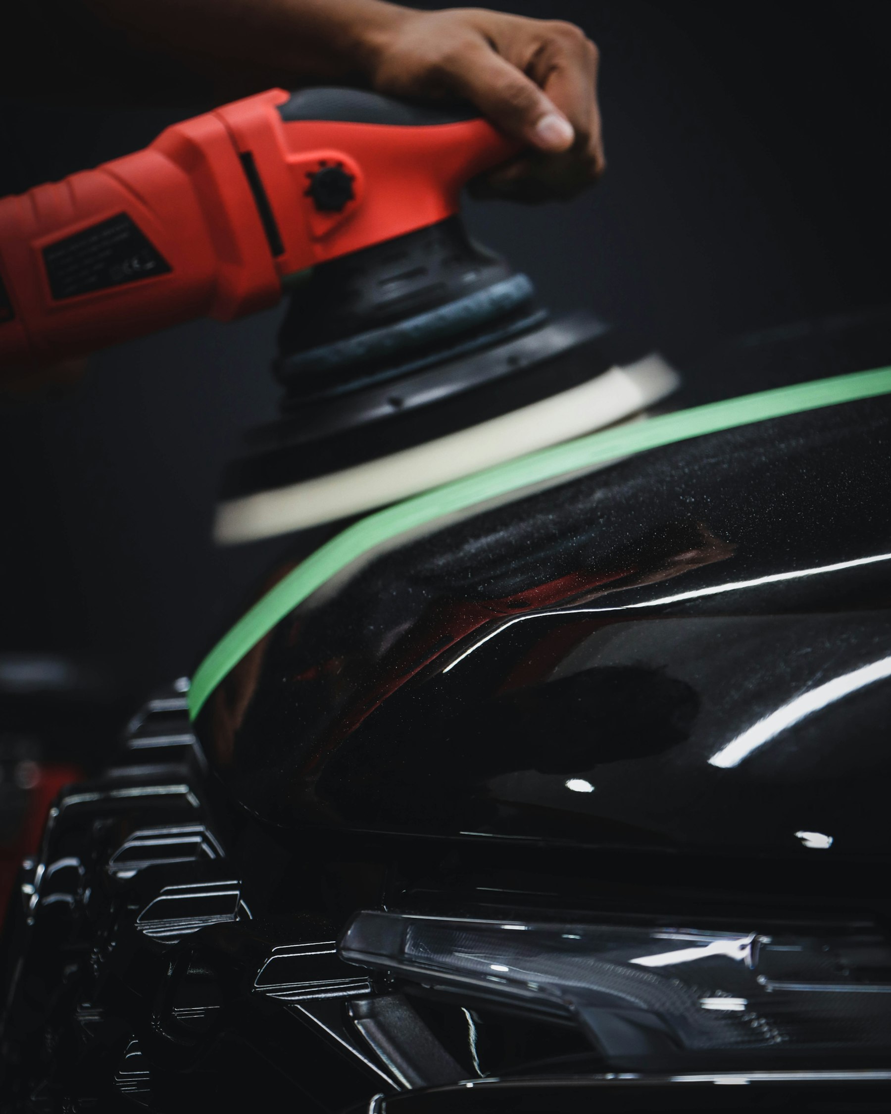 Paint correction — polisher restoring deep gloss finish