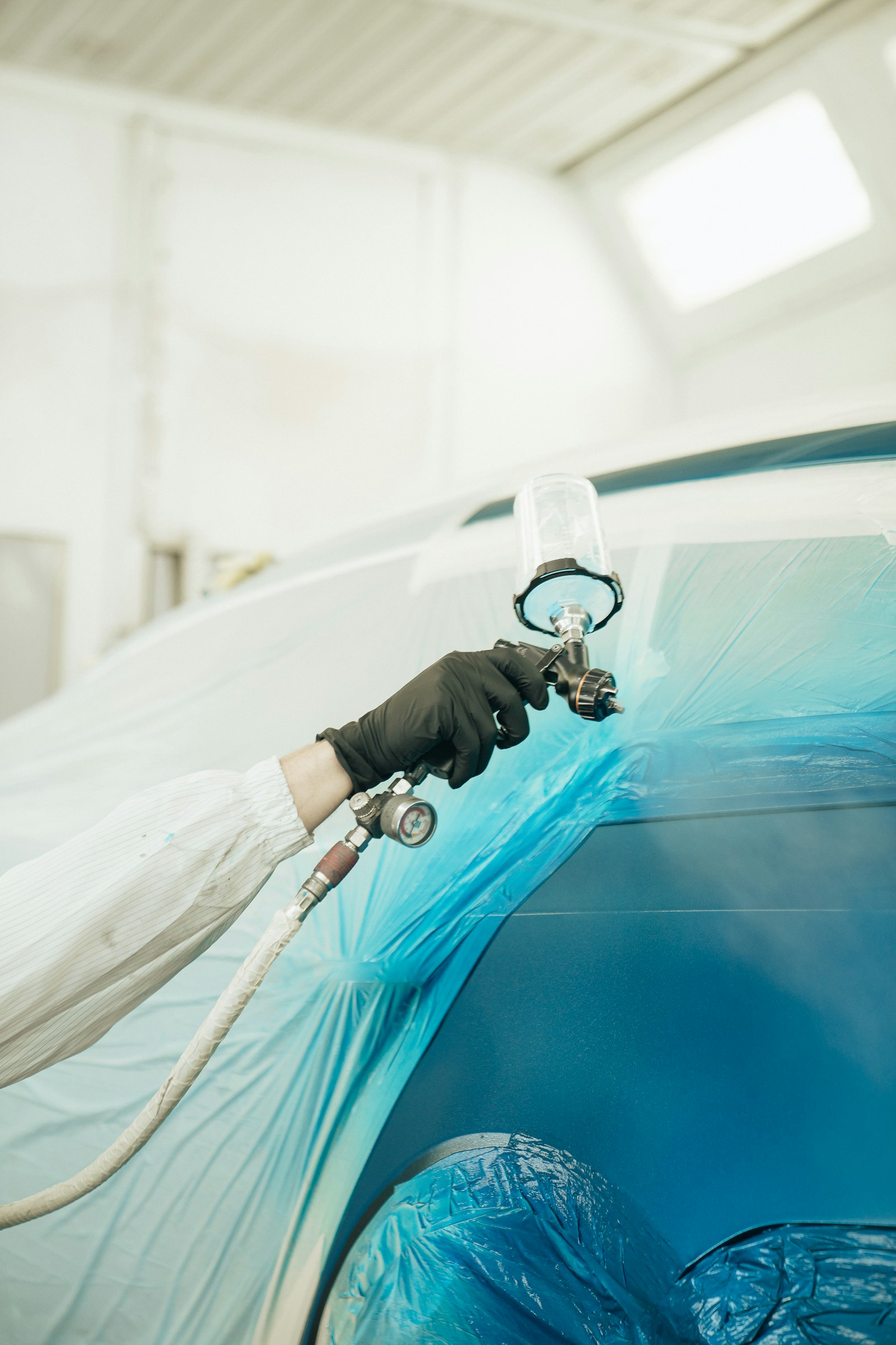 Paint protection film application in a detailing studio